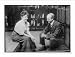 Newswire Photo (S): Annette Kellerman and C.M. Daniels, seated, talking