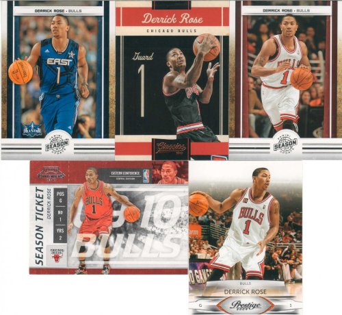 Derrick Rose 5 Card Gift Lot Containing One Each of His 2010 2011 Panini Season Update Card #76 and #188, Playoff Contenders Season Ticket and Panini Classics, and His 2009 Prestige Mint Condition Chicago Bulls Cards. Nice Mix Picturing Him in His Red, White and Black Bulls Jerseys and His Blue Eastern All Stars Jersey. Shipped in a 100 Card Cardboard Storage Box!