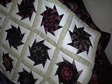Black Floral Stack 'N Whack bed quilt