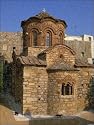 Prints of Two black cats passing the Byzantine Agio Apostoloi church from Robert Harding