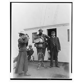 Historic Print (M): [Woman looking through sextant on board the expedition vessel, George W. Elder, with two