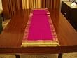 Pink Sari tablerunner with golden trim / tassels
