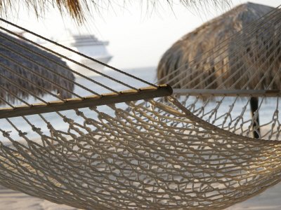 Hammock on Beach with Ship in Background, Cabo San Lucas, Mexico Photographic Poster Print by Gina Martin, 9x12