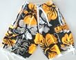 Mens "Tugger" Swim Trunks with drawstring waist, slit pockets and side flap pockets. Loop in back, fully lined. Sun/White/Black in sizes S-4XL.