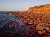 The Almost Unnatural Red of the Rocks of the Island Light up at Sunset, Prince Edward Island, Canad Artists Photographic Poster Print, 18x24