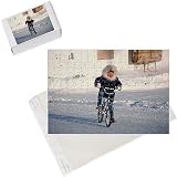 Jigsaw Puzzles of Inuit boy cycling on his mountain bike on the main street in Igloolik from ArcticPhoto