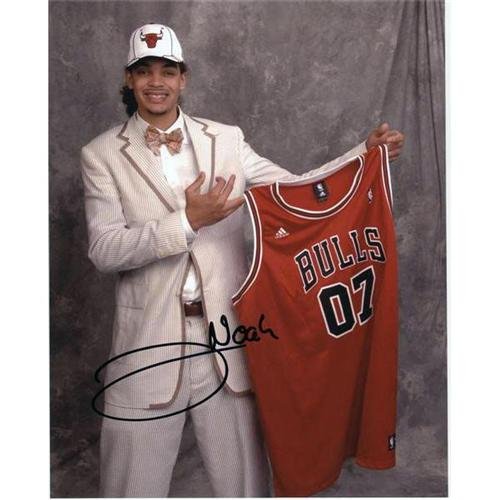 Joakim Noah Autographed Chicago Bulls (Holding Jersey) 8x10 Photo
