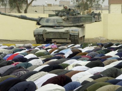 Iraqi Shiite Muslims Pray on the First Day of Eid Al-Fitr