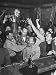 Celebrating After Hunt, Winner Herb Hartley holding cash prize, Teammates Congratulat...