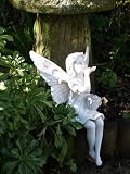 SITTING FAIRY BLOWING A KISS