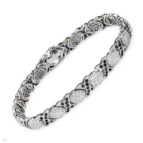 Bracelet With 10.64ctw Cubic zirconia and Sapphires Beautifully Designed in 925 Sterling silver. Total item weight 19.5g Length 7.5in