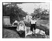 Historic Print (L): [Woman with basket on her head and 4 children standing on bank; 2 dugout boats and 2 oth