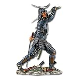 Statue of Samurai Warrior in Black Armor Wielding Two Samurai Swords in Battle