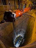 A superconducting magnet is lowered into the particle collider Photographic Poster Print by Mark Thiessen, 42x56