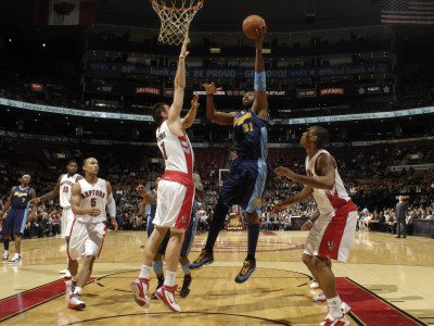 Denver Nuggets v Toronto Raptors: Nen and Andrea Bargnani Photographic Poster Print by Ron Turenne, 24x32