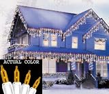 Set Of 100 Amber Everglow Icicle Christmas Lights With White Wire