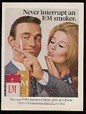 1968 Never Interrupt an L&M Cigarette Smoker Couple Print Ad (11479)