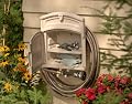 Suncast HHC150 Garden Hose Hanger with Storage Cabinet And 150-Foot-Hose Capacity