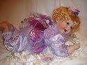 26" Porcelain Baby Doll on a Pillow