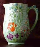 Beswick green and relief floral jug 874-2