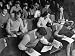 War Veterans and Co-Eds Taking Notes During Classroom Lecture at Crowded University o...