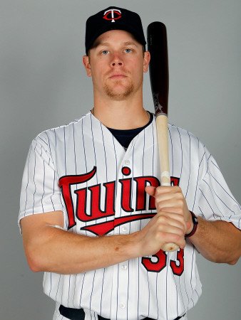 Minnesota Twins Photo Day, FORT MYERS, FL - FEBRUARY 25: Justin Morneau Photographic Poster Print by J. Meric, 18x24