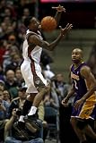 Los Angeles Lakers v Milwaukee Bucks: Brandon Jennings and Derek Fisher Photographic Poster Print by Jonathan Daniel, 12x18