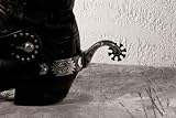 Cowboy Boots with Spurs on the Wooden Desk - 24