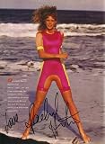 Rachel Hunter autographed Sports Illustrated swimsuit issue full page photo