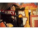 Photographic Print of Signs in neon scrap yard from Robert Harding