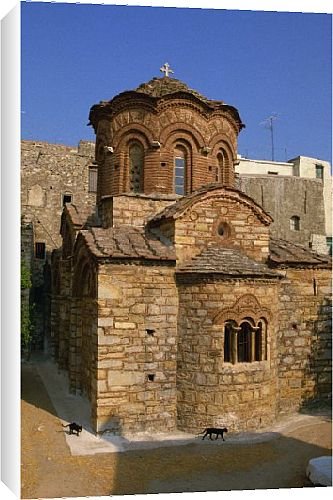 Canvas Prints of Two black cats passing the Byzantine Agio Apostoloi church from Robert Harding