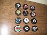 hockey pucks - Team Themed pucks - lot of 12 - execellent condition