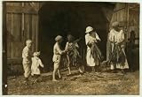 Photo Mrs. J.L. Hazel and children stripping tobacco. A very interesting and poorly educated family. See special