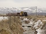 A Train Follows Alongside a River Photographic Poster Print by Taylor S. Kennedy, 48x36