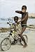 photo poster Young boys on bike at the beach. in size: 20 x 30 cm by C. Aslund