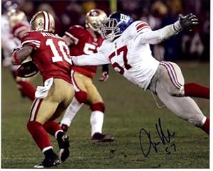 New York Giants Jacquiqn Williams strips the ball during the NFC championship game. Autographed 8x10 photo.