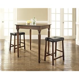 Click here to buy Crosley Furniture 3 Piece Pub Dining Set with Turned Leg and Upholstered Saddle Stools in... by Crosley Furniture.