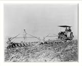 Historic Print (L): [Tractor pulling large set of discs across field]