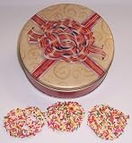 Scott's Cakes White Chocolate Covered Pretzel with Rainbow Jimmies in a Mini Red Bow Tin