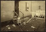 Photo Annie Fedele crocheting on underwear out in the filthy back yard. This is one of the places she works on crochet.