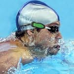 #1: AquaCube Waterproof 4GB MP3 Player with Waterproof In-Ear Earphones for Underwater Swimming, Surfing, Shower, skiing and water sports – Attaches to swimwear, goggles and other clothing