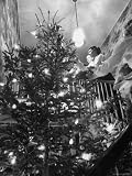 Mrs. George Sutton and Her Family Decorating Their Christmas Tree at Home Photographic Poster Print