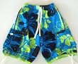 Mens "Tugger" Swim Trunks with drawstring waist, slit pockets and side flap pockets. Loop in back, fully lined. Teal/Lime/Black in sizes S-4XL.