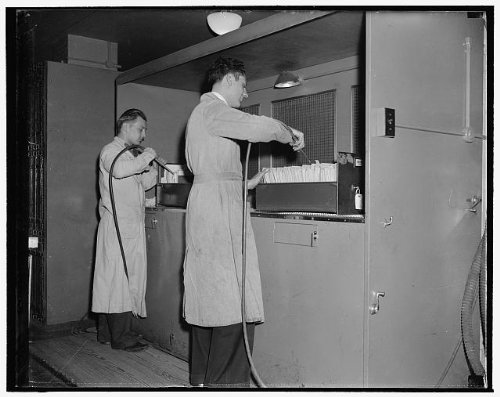 Photo Reprint National Archives. Washington, D.C., Nov. 22. After leaving the gas chamber the documents are worked
