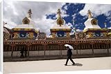 Canvas Prints of Man with umbrella at temple, Yushu, Qinghai, China, Asia from Robert Harding
