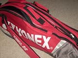 Production Date Unknown: YONEX Tournament Tennis 4-6 Racquet Bag with two zippered racket compartments and side zip pocket. Detachable shoulder strap. Sturdy handle. Rare older color combo in like new condition.