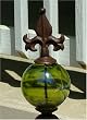 Rustic Iron Fleur de Lis Obelisk with Green Glass Gazing Globe