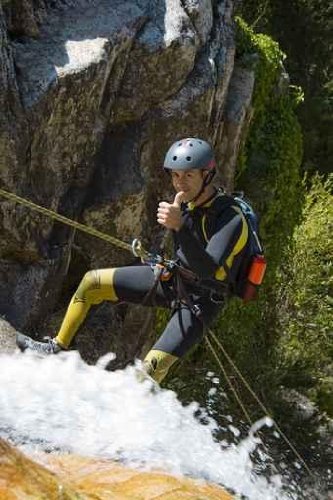 Men Descending Waterfall in Rappel - 18