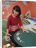 Canvas Prints of Portrait of a woman hand painting umbrellas in Chiang Mai from Robert Harding