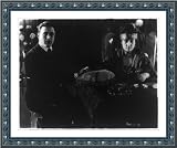 Historic Print (S): Do you believe in spirits? George Walsh, Fox movie star, is seen gazing intently into sp
